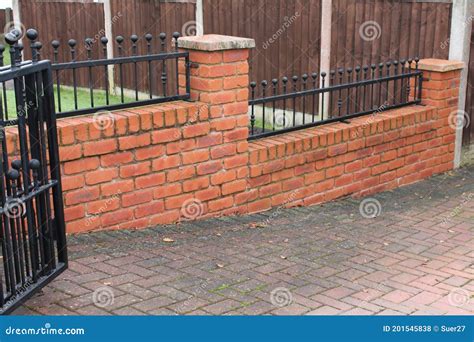 secure metal house gate to wall|hanging metal gates on brick wall.